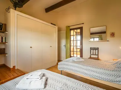 a bedroom with two beds and a large closet at Villa in Beaufort with Pool & Views in Beaufort