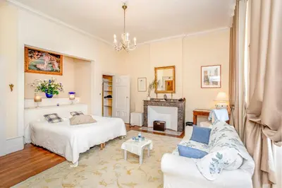 a bedroom with a bed and a table at Château du Pegulier in Montaut-Ariège