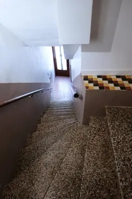 a bathroom with a hallway with a tile floor at Gîte proche du canal du midi et Narbonne 2 chambres in Mirepeisset