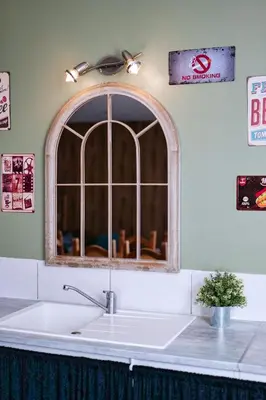 a sink in a kitchen with a window at Gîte proche du canal du midi et Narbonne 2 chambres in Mirepeisset
