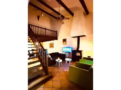 a living room with a couch and a table at Charming French Villa with Pool in Cébazan