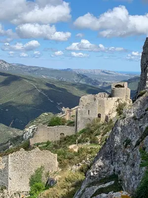a castle on the side of a mountain at L'Ecurie in Paziols