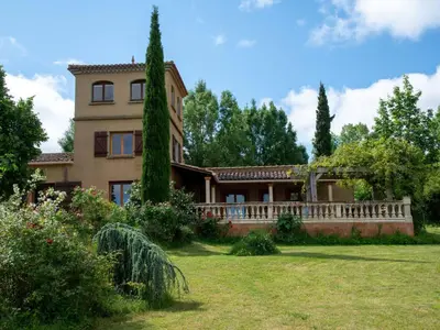 a large house with a fence and a yard at Holiday Home Les Ecuries by Interhome in Alet-les-Bains