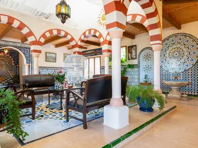 a room with a blue bed with a mosaic wall at Holiday Home Les Ecuries by Interhome in Alet-les-Bains