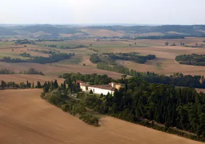 an aerial view of a house in the middle of a field at La Ginelle - Appartement Bocage in Airoux
