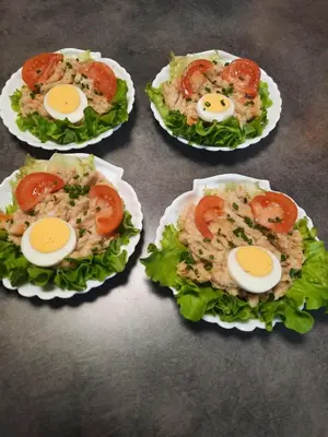 a table with four plates of food with eggs on it at L'Amandier in Maury