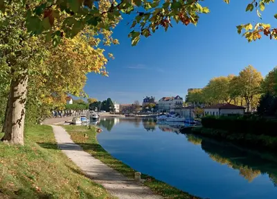 a view of a river with boats on it at Logis Hotel - Restaurant La Marbrerie in Caunes-Minervois