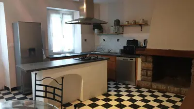 a kitchen with a stove and a counter top at LE CLOS DES COLVERTS in Campagne-sur-Aude