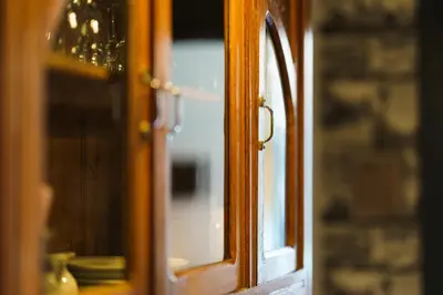 a close up of a wooden window in a room at Logement Onze Chambres & Gîtes in Raissac-dʼAude