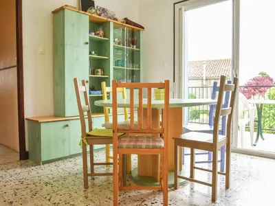 a dining room with a table and chairs at Holiday Home Talairan with Pool and BBQ in Talairan
