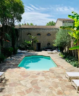 a large swimming pool in front of a building at 45BB Apartment in Carcassonne