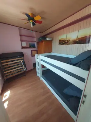 a bedroom with a bed and a ceiling fan at ALBASUD - Appartement meublé avec terrasse - Salses le Chateau 66 in Salses-le-Chateau