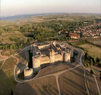 an aerial view of a castle on a field at ALBASUD - Appartement meublé avec terrasse - Salses le Chateau 66 in Salses-le-Chateau