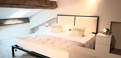 a kitchen with a sink and a stove top oven at Loft Chic in Carcassonne