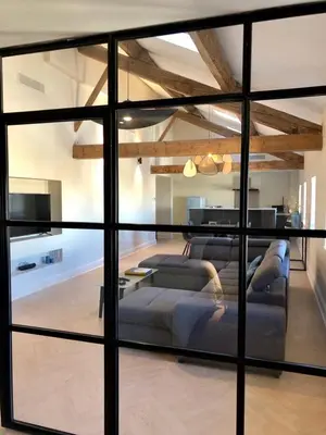 a living room with a couch and a table at Loft Chic in Carcassonne