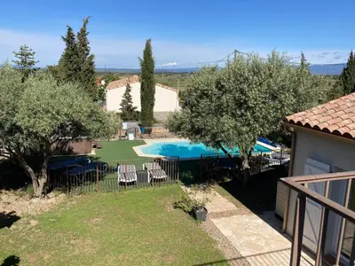 a view of a swimming pool in a yard with trees at Montbrun Vineyard Escape in Montbrun-des-Corbières