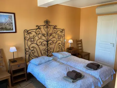 a bedroom with a bed with two towels on it at Montbrun Vineyard Escape in Montbrun-des-Corbières