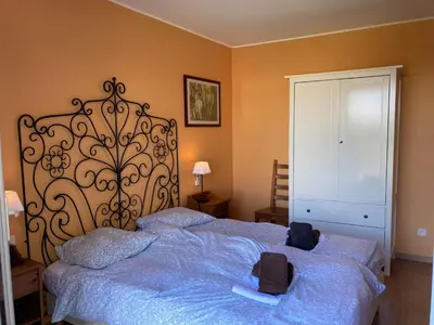 a bedroom with a large bed with blue sheets at Montbrun Vineyard Escape in Montbrun-des-Corbières