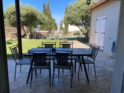 a black table and chairs on a patio at Montbrun Vineyard Escape in Montbrun-des-Corbières