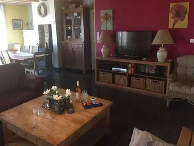a living room with a coffee table and a tv at Villa Retreat with Pool and pets in Vélieux
