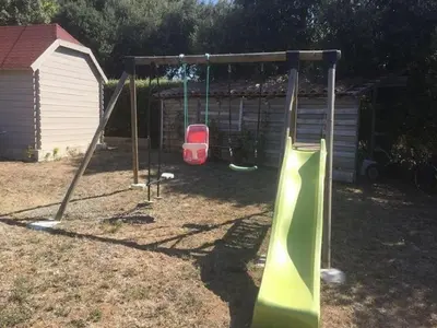 a swing set in a yard with a playground at Villa Retreat with Pool and pets in Vélieux