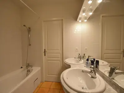 a bathroom with two sinks and a toilet and a tub at Villa in Escales with Private Pool in Escales
