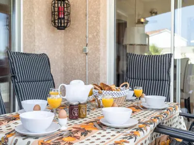 a table with a table cloth with breakfast food on it at Villa in Escales with Private Pool in Escales