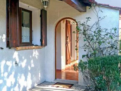 an entrance to a house with an open door at Holiday Home Les Hauts de Grimmal by Interhome in Salles-dʼAude