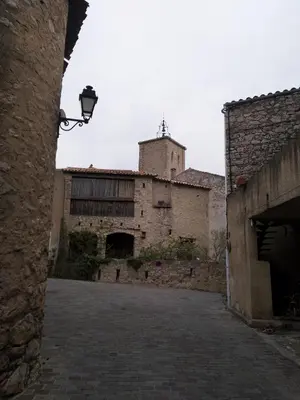 an old building with a street light in front of it at Les lavandes in Duilhac