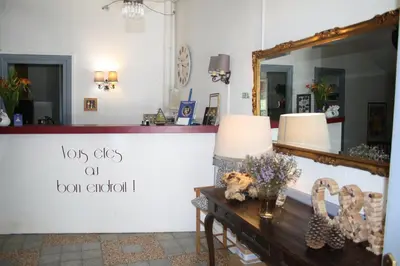 a dressing room with a mirror and a table at Le Therminus chambres d hôtes in Rennes-les-Bains