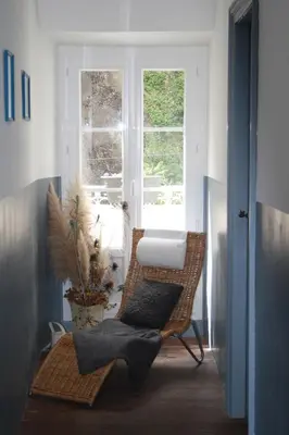 a room with a chair and a window at Le Therminus chambres d hôtes in Rennes-les-Bains