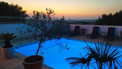a swimming pool with blue lights on it at sunset at La Belle Vie B&B in Montréal