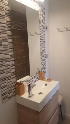 a bathroom with a sink and a mirror at La Belle Vie B&B in Montréal