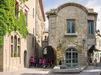 a group of people standing outside of a building at Tranquil Villa with Pool in Lézignan-Corbières
