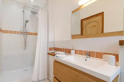a bathroom with a sink and a tub and a shower at Domaine de la Matte in Conques-sur-Orbiel