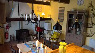 a dining room with a table with candles on it at Stunning view in Cathar country in Cailla
