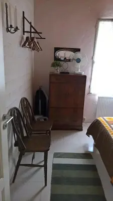 a bedroom with a bed and a chair and a dresser at Stunning view in Cathar country in Cailla