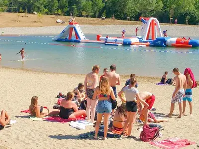 a group of people on the beach at the water park at Holiday Home in Quillan near Pyrenees in Quillan