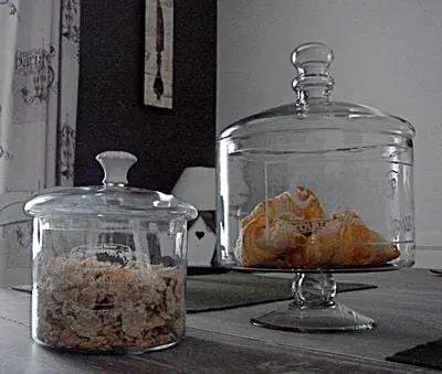 a glass jar with food in it on a table at Chambres d'hôtes Le Pessac in Vielmur-sur-Agout