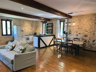 a living room with a couch and a table at Gites de Montcabirol in Mirepoix