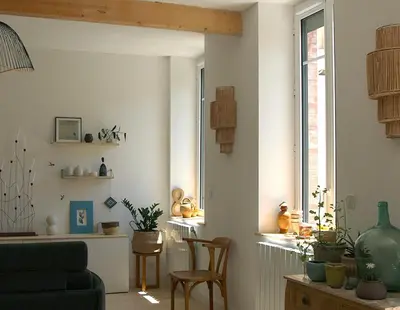 a living room with a couch and chairs and a window at midi03 in Carcassonne
