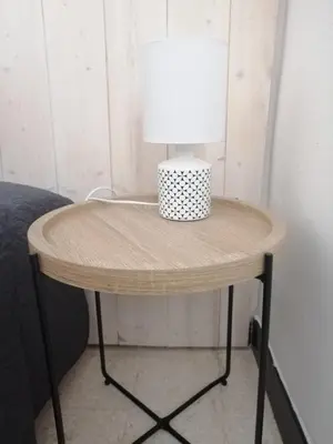 a table with a lamp on top of it at La Maison CANTHEZ Wifi in Sigean
