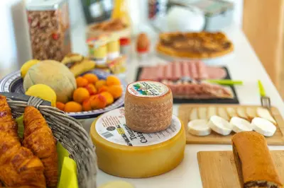 a table topped with lots of different types of food at Domaine de Merlac in Rieussec