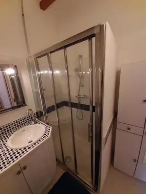 a bathroom with a shower and a sink at Lotus in Cébazan
