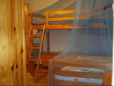 a bedroom with two bunk beds and a ladder at Mini-Hôtel de Camps in Camps-sur-lʼAgly
