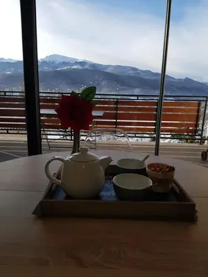 a tray with a tea pot and bowls on a table at Gites du pech cathare in Leychert