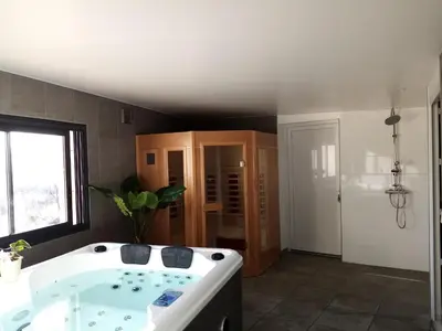 a bathroom with a bath tub and a sink at Gites du pech cathare in Leychert