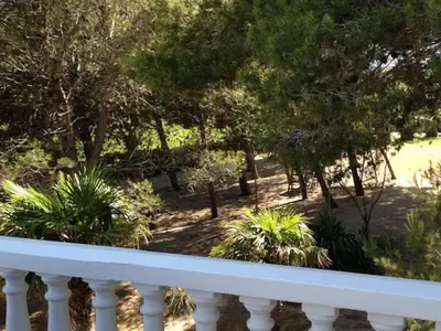 a view of a garden from a balcony at La Pinède D'Estarac in Bages