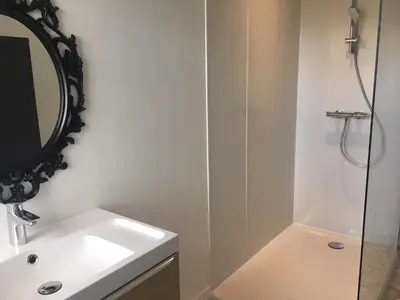 a bathroom with two sinks and a large mirror at MAISON MIGNARDISE - Cité in Carcassonne
