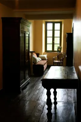 a living room with a couch and a table at L'affable Les cammazes in Les Cammazes